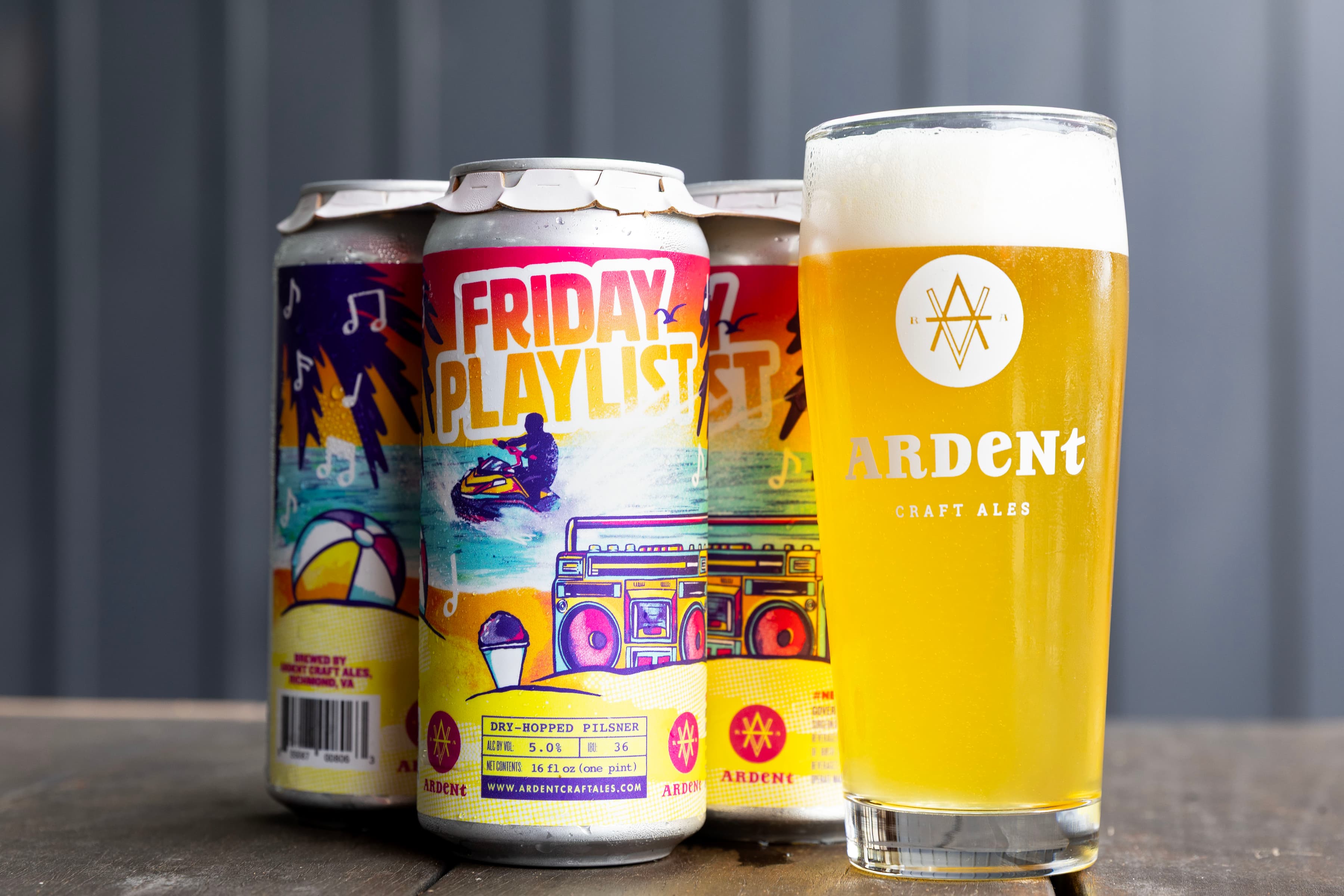 4-pack bright, sunset-colored cans of Friday Playlist next to a full, tall glass of golden beer